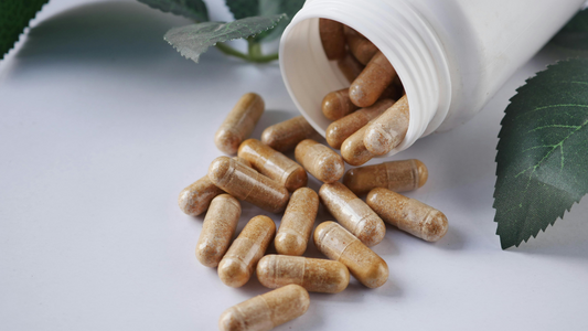 Homemade magnesium glycinate capsules poured out for supplement dosing