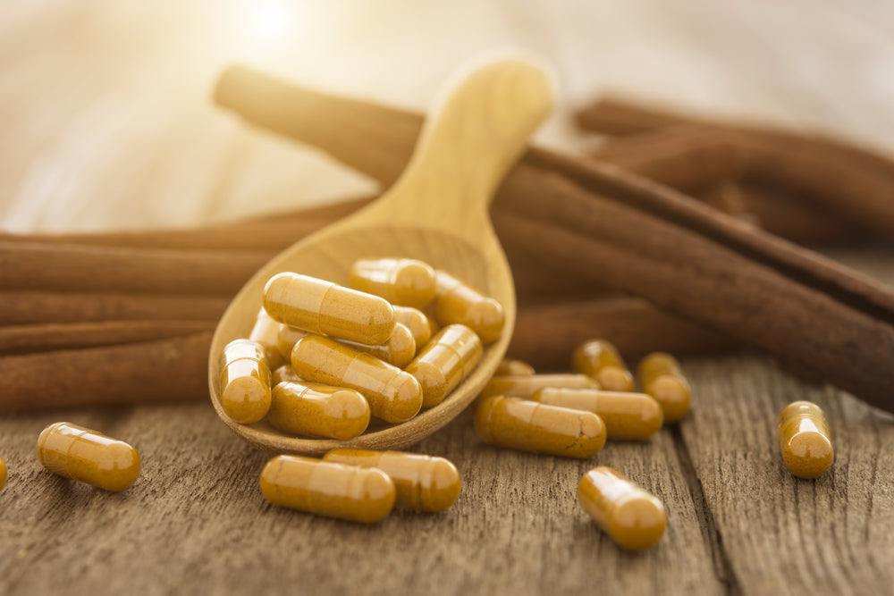 turmeric capsules with cinnamon sticks